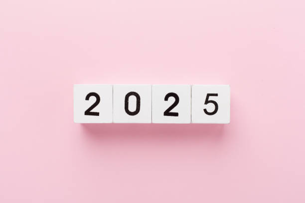 istock Cubes with 2025 on color background, top view 2185456696