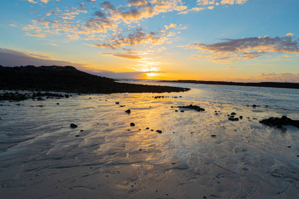 Cotillo beach and volcanic rocks during sunset. Fuerteventura North western part.Amazing intertidal sand formations.