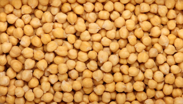 istock Soaked chickpeas filling the frame, creating a textured background 2185459080