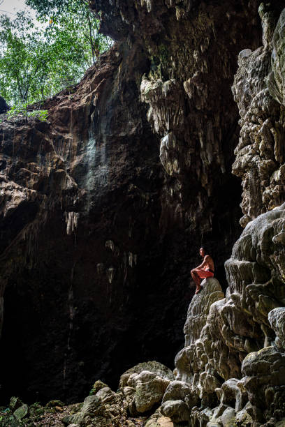 istock Man exploring Chieu Cave at Mai Chau - Vietnam 2185462246