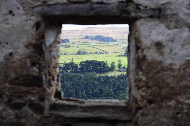 istock Looking through the window of an abandoned farmhouse 2185467734