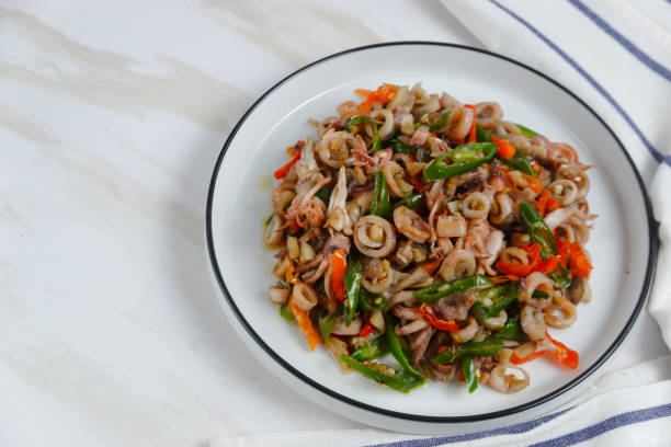 istock stir-fried salted squid with green chili. 2185468637