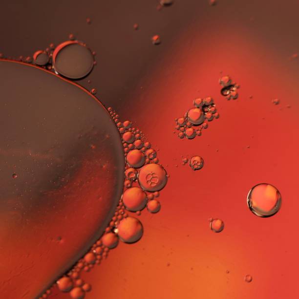 istock Numerous Droplets of Oil on Water 2185471754