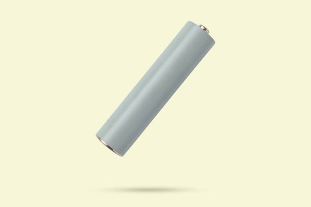 istock AAA alkaline battery flying on yellow background 2185472727