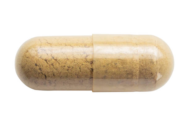 istock Herbal medicine capsule isolated on white background 2185472737
