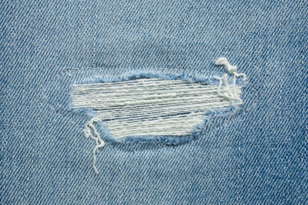 istock Denim blue jeans torn fashion design texture close up background 2185472978