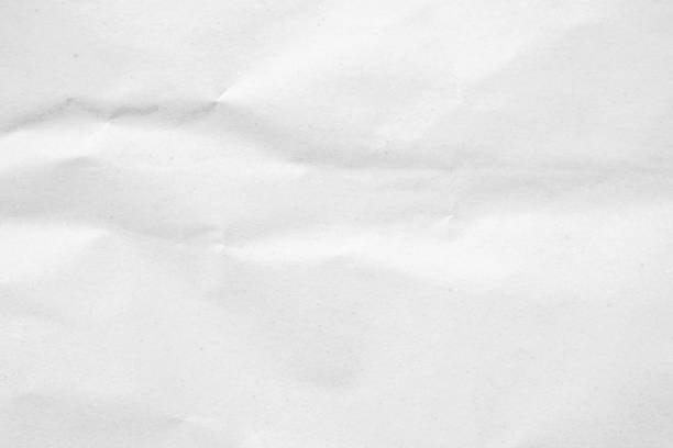 istock White recycled craft paper texture as background. Grey paper texture, Old vintage page or grunge vignette of old newspaper. Pattern rough art creased grunge letter. Hardboard with copy space for text. 2185473034