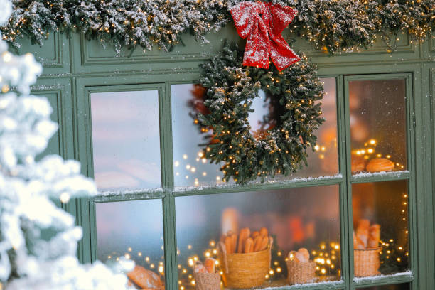 istock Cozy winter bakery window adorned with festive decorations and baked goods 2185473683