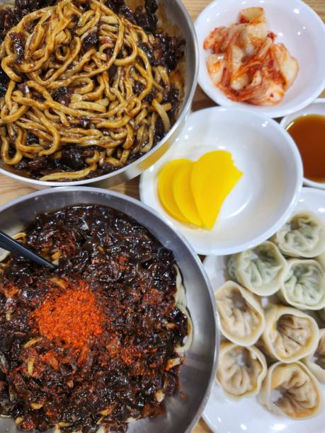 istock Jajangmyeon, a popular Korean dish featuring thick wheat noodles topped with a rich, savory black bean sauce made from chunjang, diced pork, and vegetables. Hearty and flavorful, it’s a comforting, satisfying meal. 2185475615