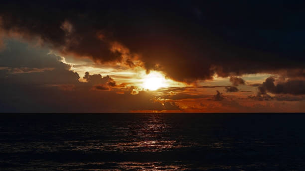 istock The sunset on a day covered with many rain clouds. 2185478041