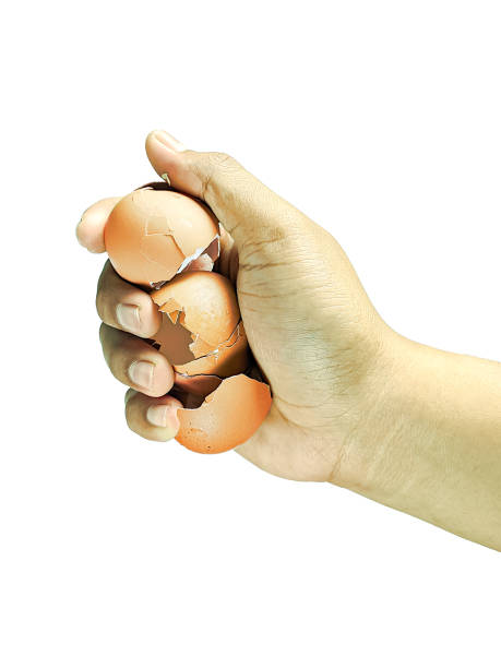 istock Close-up view, Asian man hand holding chicken egg cracked isolated on white background 2185480606
