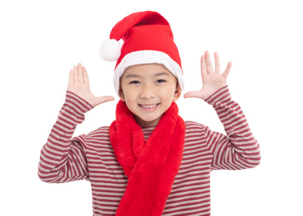 Happy asian  Kid Dressed as Santa isolated on white