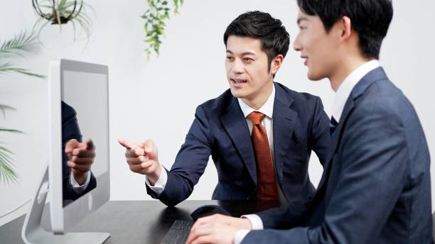 istock Businessmen looking at a screen and having a meeting 2185488858