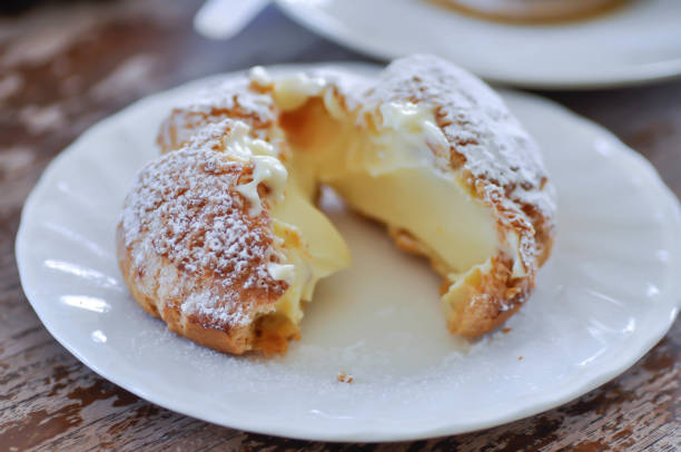 istock choux cream or cream puff, eclair in a small dish 2185490880