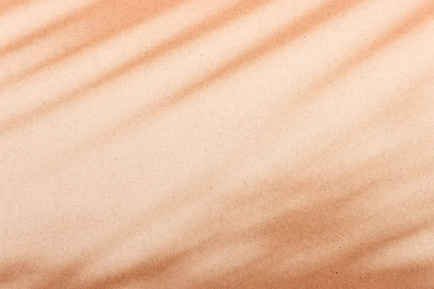 istock Background of texture and shadow abstract. Pastel orange colors. 2185496540