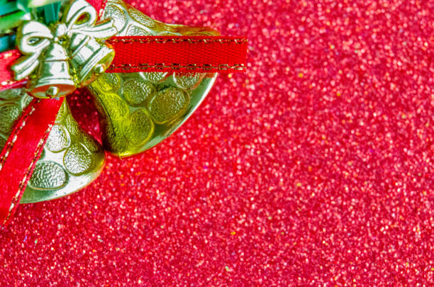 Christmas Bells on red background with customizable space for text or for wishes. Christmas celebration concept.