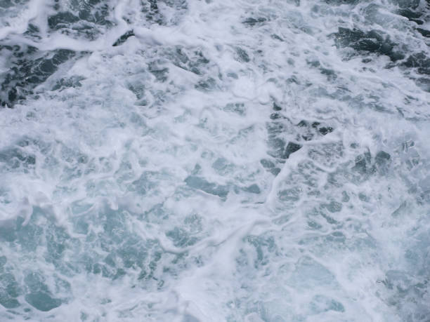 istock blurry image of abstract blue sea water with white wave for background 2185498053