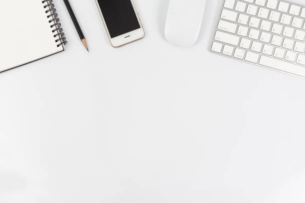 istock Top view of working desk white with smartphone, computer and office supplies 2185499264