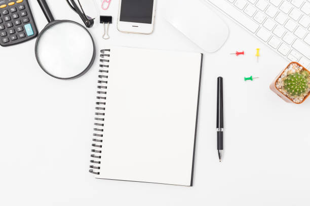 istock office desk with smartphone, computer and office supplies top view 2185499782