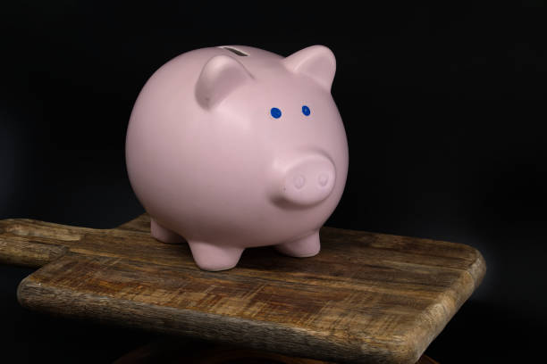 istock Close-up ceramic piggy bank over black background 2185499803