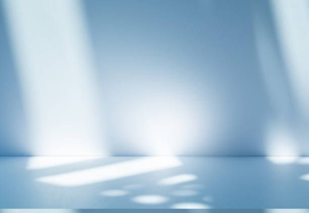 istock Studio style background wall decoration presentation uses white and blue tones. with shadows cast from a nearby window, concept creating a decorative 2185503532