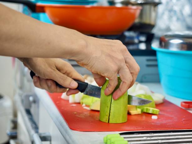 istock Cooking preparation image of fresh zucchini being cut 2185506245