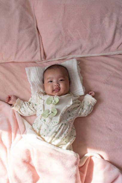 istock Shoot the little baby lying on the bed from above 2185507913