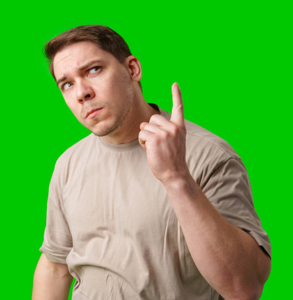 istock Thoughtful man gestures against a green background 2185508685