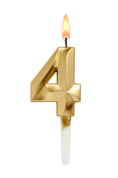 istock Golden decorated burning birthday candle digit four shaped isolated on white. 2185508722