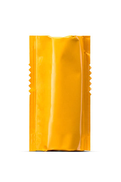 istock Plastic unpacked yellow package with 120mm camera film roll isolated on a white. 2185508728