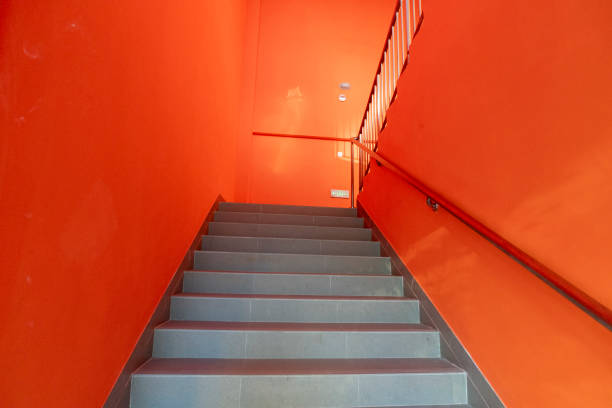 istock Stairs with orange walls 2185509979