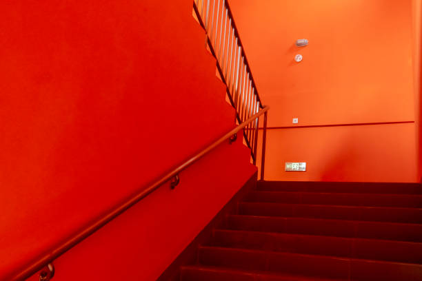 istock Stairs with orange walls 2185510012