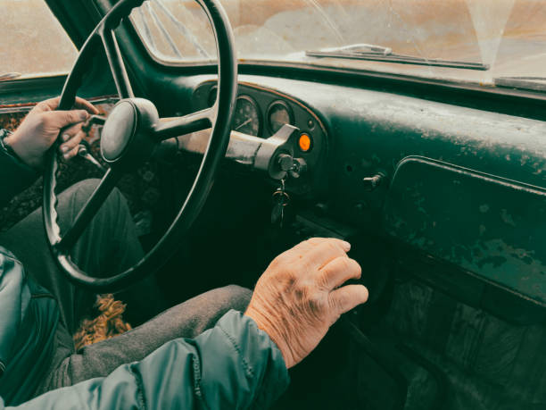 istock A man is driving a car with a key in the ignition 2185512415