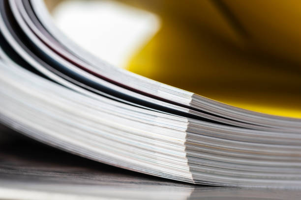 istock Stack of bent book pages, focus on their edges 2185512773