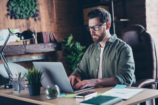 istock Photo of smart clever programmer dressed shirt coding modern gadget indoors workstation workshop 2185515311
