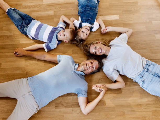 istock Above view happy family resting on floor at home. 2185515539