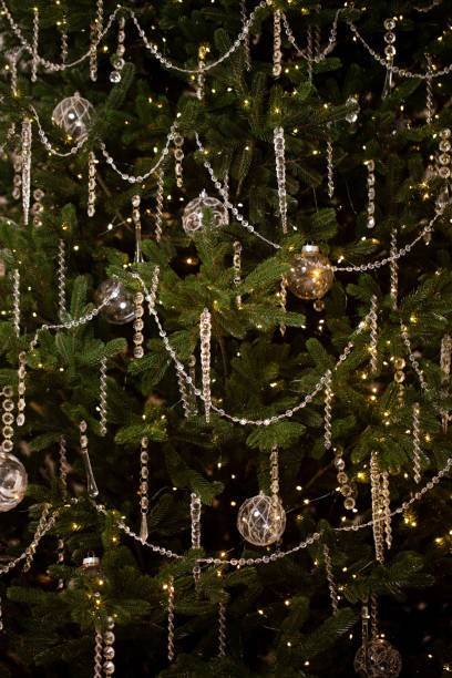 istock A Christmas tree with many ornaments and lights 2185515660