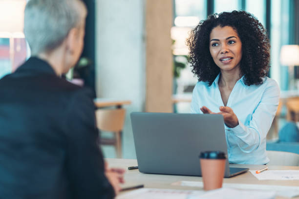 istock Businesswomen having a discussion during a meeting 2185515683