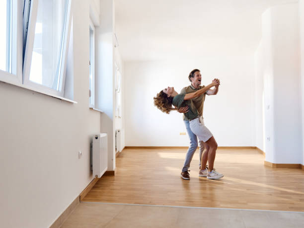 istock Happy couple dancing in their new apartment. 2185516609
