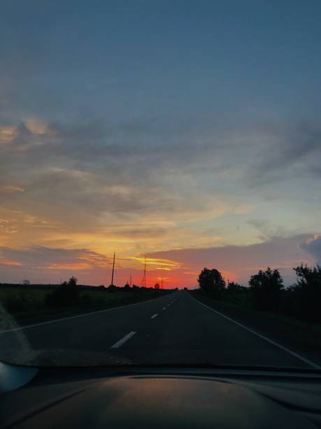 istock Scenic sunset view from a car on a rural road trip 2185517388