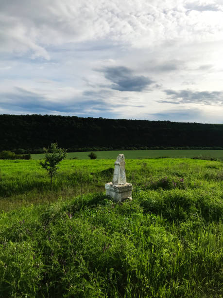 istock Ancient stone monument in tranquil rural field landscape 2185517411