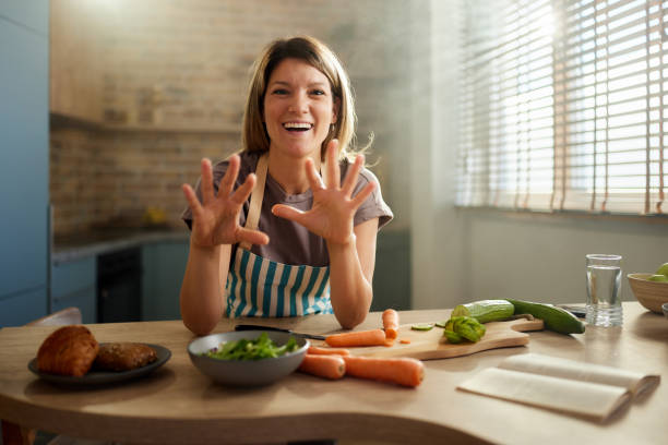 istock Happy woman having online cooking class in the kitchen. 2185517507