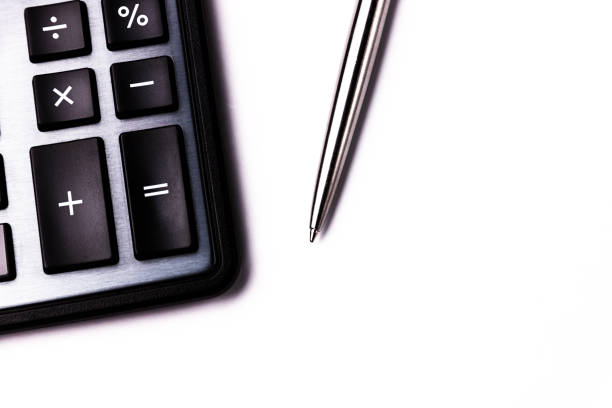 Calculator and pen on white background. Business background. Copy space