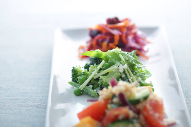 Image of various salads such as vegan dishes, root vegetables, and summer vegetables served in bowls