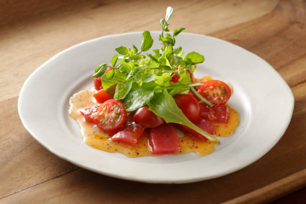 Freshly prepared dishes include various meats, vegetables, and garnishes showcasing the diversity of Ukrainian and Japanese culinary traditions.