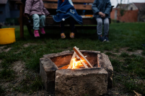 istock Selective focus on campfire in backyard with children sitting in background. 2185526563