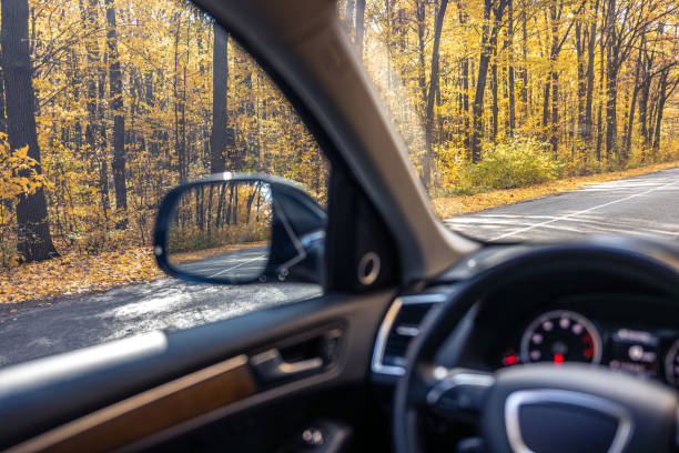 istock Rear view side mirror of a car. Seen through the rear view mirror. 2185528363