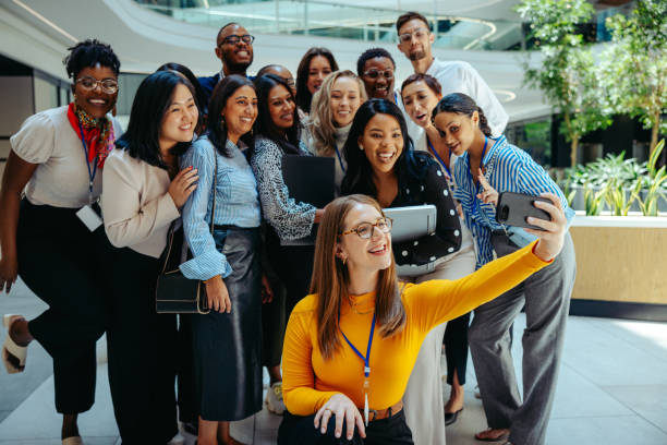 istock Team at auditing firm celebrates the new hires' first day 2185528623