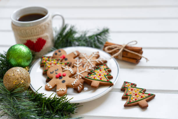 Christmas coffee and gingerbread cookies on rustic wooden table