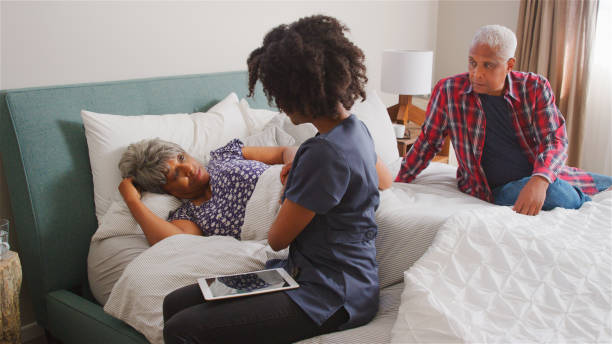istock Nurse Visiting Senior Woman Lying In Bed Suffering With Depression 2185532093